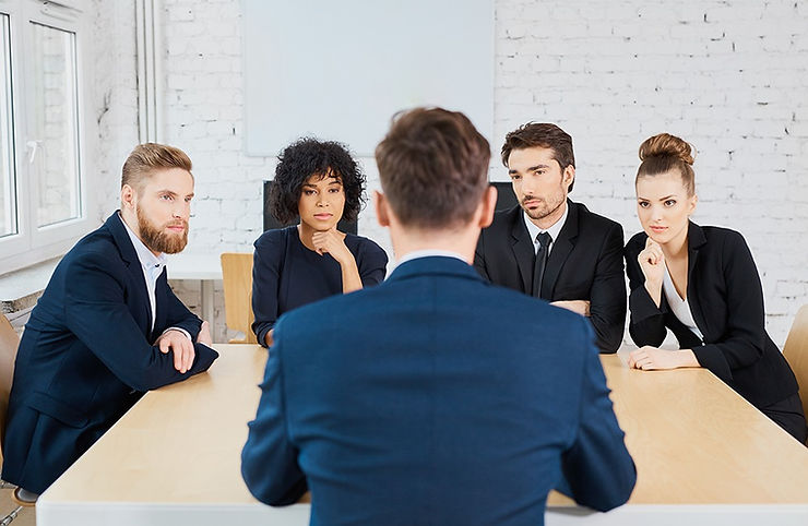 image of business manager addressing team of four people